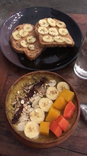 Smoothie bowl and peanut butter banana toast  at Sacred Lotus Cafe in Phnom Penh