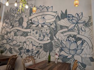 Beautiful artwork on the walls at Sacred Lotus Cafe in Phnom Penh