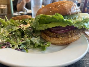 Nutty burger with dressed greens for the side.   at Fox & Goose Public House in Sacramento