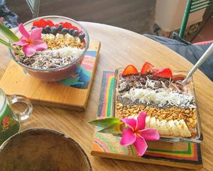 Two Acai Bowls at a nearby table. at Tropical Kitchen Cabo in Cabo San Lucas
