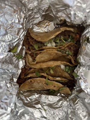 Yummy taquitos with prepared soy, pea and wheat proteins. Everything with onion and coriander + lemon and hot sauce (not pictured)  at Yoyu in Tlalnepantla
