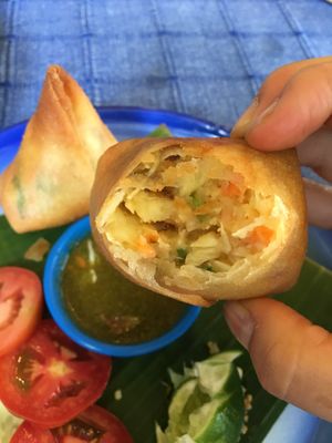Freshly cooked - steaming hot, potato-ey filling. Perfectly crisp and crunchy wrapping. at Free Bird Cafe in Chiang Mai