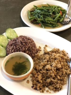 Pepper garlic plant based “pork” and stir fry morning glory   at CMU Vegan - Kinphak Cafe in Chiang Mai