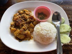 Yellow curry with white rice, 55 baht  at CMU Vegan - Kinphak Cafe in Chiang Mai