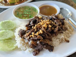 Oily rice with fried shiitake mushroom stipe (60 THB)  at CMU Vegan - Kinphak Cafe in Chiang Mai