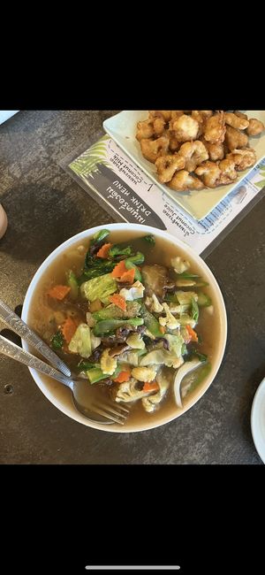 Flat noodles with gravy (better without) and fried cauliflower   at CMU Vegan - Kinphak Cafe in Chiang Mai