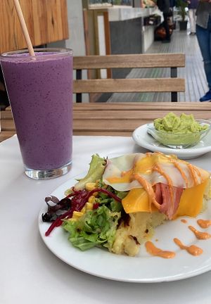 Tortilla with egg and bacon and guacamole+ mix berry smoothie ❤️  at Veganitessen in Sevilla
