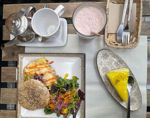 Absolutely delicious for a great price. Ordered sriracha (scrambled egg, cheese, guacamole and sriracha mayo with toasted bread). Came with milkshake, tea and desert of choice.  at Veganitessen in Sevilla