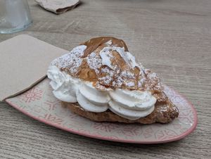 Cream filled croissant with a little Lotus butter on top at Veganitessen in Sevilla