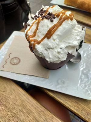 Gluten free chocolate cupcake with whipped cream at Veganitessen in Sevilla