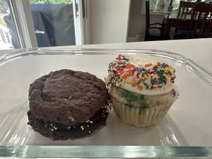 Cosmic brownie cookie sandwich, funfetti cupcake  at For Goodness Cakes - Food Truck in Baiting Hollow