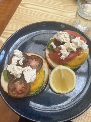 Bagel with avocado, tomatoes and feta  at Oh My Days in Glebe