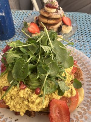 Toast with scrambled tofu and avocado  at Mama Carmen's Coffee & Bakery in Mallorca