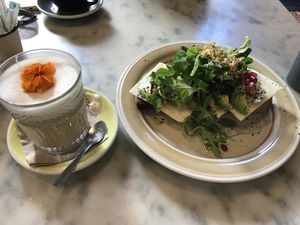 Coffee with oat milk and a vegan toast at Mama Carmen's Coffee & Bakery in Mallorca