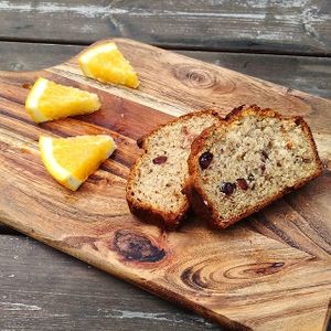 Banana bread with cranberries and slice of orange is a great dessert. Of course if you still have any place after eating a burger! at Enjoy Moon in Oslo