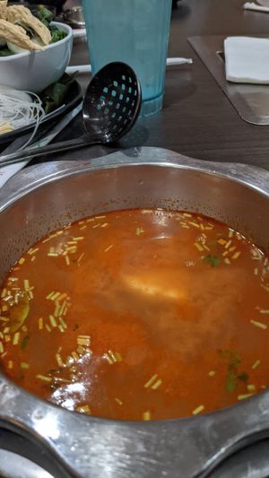 Tom yum broth at K & L 98 HotPot in Boynton Beach