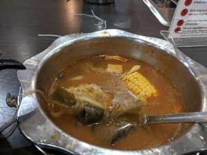 Tom yum base and veggies at K & L 98 HotPot in Boynton Beach