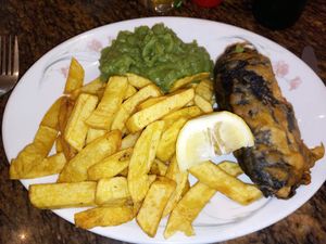 Banana blossom fillet, chips and mushy peas. Very tasty. at The London Fryer in Paignton