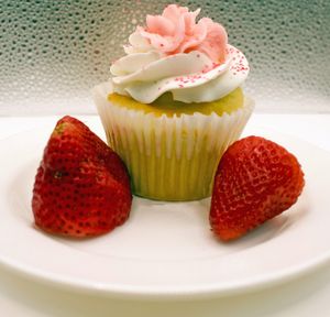 Strawberry Cupcake with fresh cut strawberries inside at Sarasota Bakehouse in Sarasota