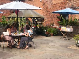 The beautiful courtyard. No picture can do it justice, surrounded by flowers and hidden antiques. Be careful of the Robin though... He'll pinch your bread when you aren't looking at The Crew Yard in Edwinstowe