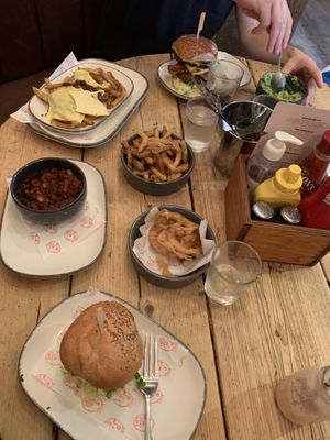 Burgers, fries, beans and onion rings  at Hubbox in Truro