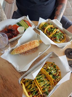 Elote, wings, chorizo tacos at Earth Plant Based in Phoenix