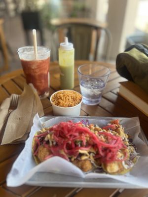 Crazy shrimp tacos and a side of Mexican rice with mild salsa  at Earth Plant Based in Phoenix