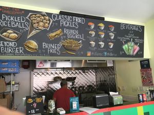 The counter at Diller, with server cooking burger and fries. at Diller in New York City