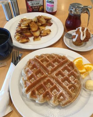 À la carte vegan breakfast: waffle, breakfast potatoes, seasonal mini muffin (pumpkin spice) & a bottomless cup of joe. Excellent all around. at Olivia's Organic Cafe in Burnsville