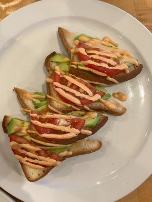 Avocado Toast with Tomato at Olivia's Organic Cafe in Burnsville