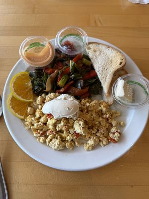Tofu scramble with sautéed greens and gluten free toast   at Olivia's Organic Cafe in Burnsville
