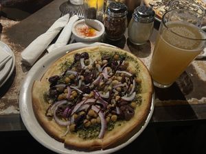 Their “Vegan Pie” as shown in the picture is served on their gluten free crust (which is vegan but their normal crusts are also vegan).   at Alibi Room in Seattle