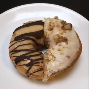 Baby Got Back (peanut butter & dark chocolate) / roasted walnuts  at Boneshaker Doughnuts in Paris