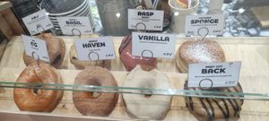 Variety of donuts at Boneshaker Doughnuts in Paris