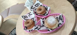 Happy donuts with friends at Boneshaker Doughnuts in Paris