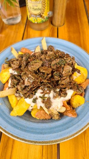 Salchipapa with shredded beef at Alma y Café in Cali