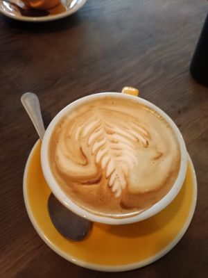 Latte with oatly at The Breakfast Club in East London