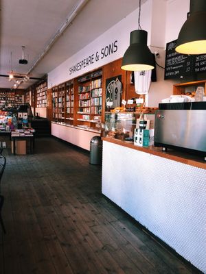 Interior looking towards Shakespeare & Sons book shop and café dining area. at Fine Bagels @ Shakespeare and Sons in Berlin