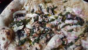 Garlic, mushrooms, and walnut creamy pizza! at Flat Earth Pizzas in East London