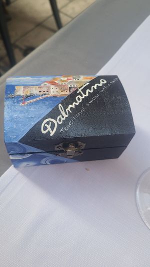 Check is delivered in a cute box at Dalmatino in Dubrovnik