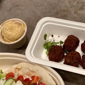 Side of falafel and side of garlic hummus (teeny tiny hummus) at Journey Cafe in Kailua Kona