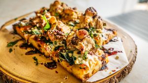 Herbed Rotisserie Jackfruit on our house made Breadfruit Sourdough with Hibiscus Marinara, local kale, slow roasted garlic, and housemade mozzarella with local basil, and olive oil at Journey Cafe in Kailua Kona