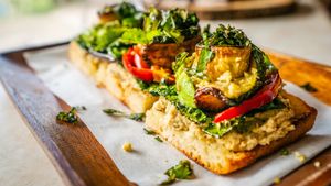 Roasted eggplant, kale, zucchini, sweet & spicy cherry peppers, cashew parmesan, basil, olive oil on a homemade breadfruit sourdough.
 at Journey Cafe in Kailua Kona