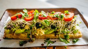 Avocado, artichoke hearts, kalamata olives, clover sprouts, tomatoes, cherry peppers, roasted garlic, cilantro, olive oil at Journey Cafe in Kailua Kona