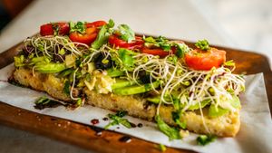Avocado, artichoke hearts, kalamata olives, clover sprouts, tomatoes, cherry peppers, roasted garlic, cilantro, olive oil at Journey Cafe in Kailua Kona