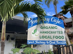 Outdoor restaurant sign  at Journey Cafe in Kailua Kona
