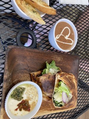 BBQ Pocket with tomato soup. Like a calzone with added fresh salad. Comes with tasty “mozzarella” sauce    at Journey Cafe in Kailua Kona