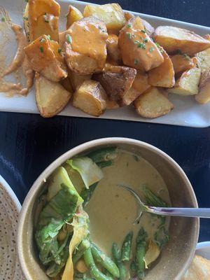 Paprika Potatoes and chickpea thai curry - heavenly !!  at Tapas Ibiza. La Finca Escondida in Ibiza