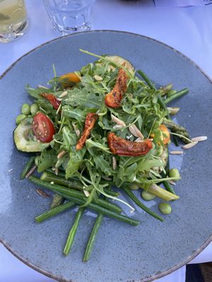 Asparagus salad with beans, arugula, zucchini and tomatoes. Order without cheese for it to be vegan.  at Van der Valk in Goes