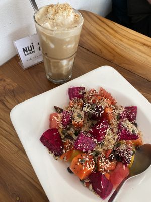Coffee with coconut ice and foam + super fruit salad  at Nui Bakery in Koh Tao